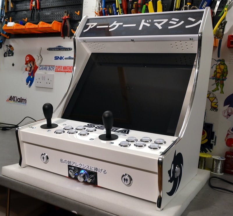 Handcrafted custom arcade machine being assembled in the Tiny Arcade Machines workshop.